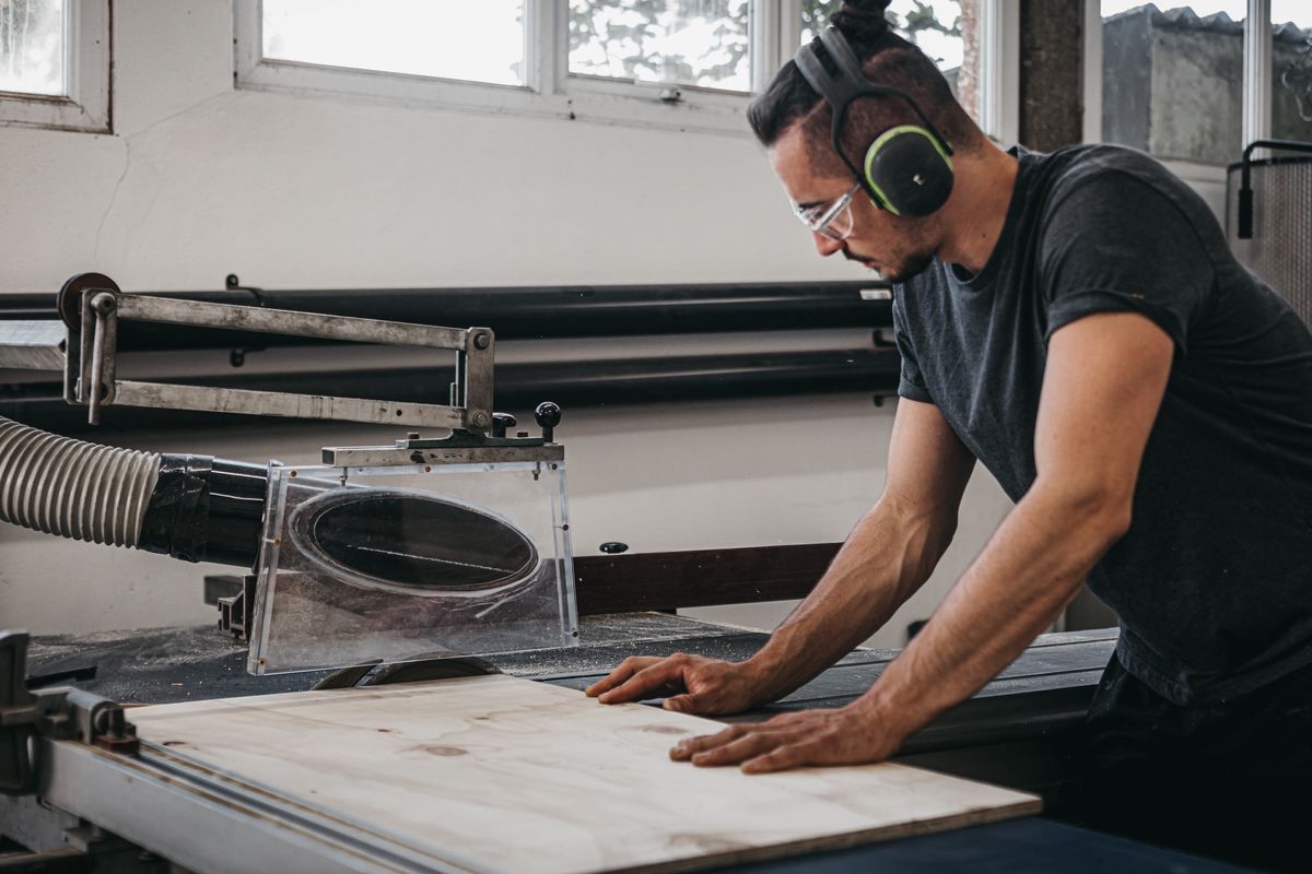 Sam using a table saw